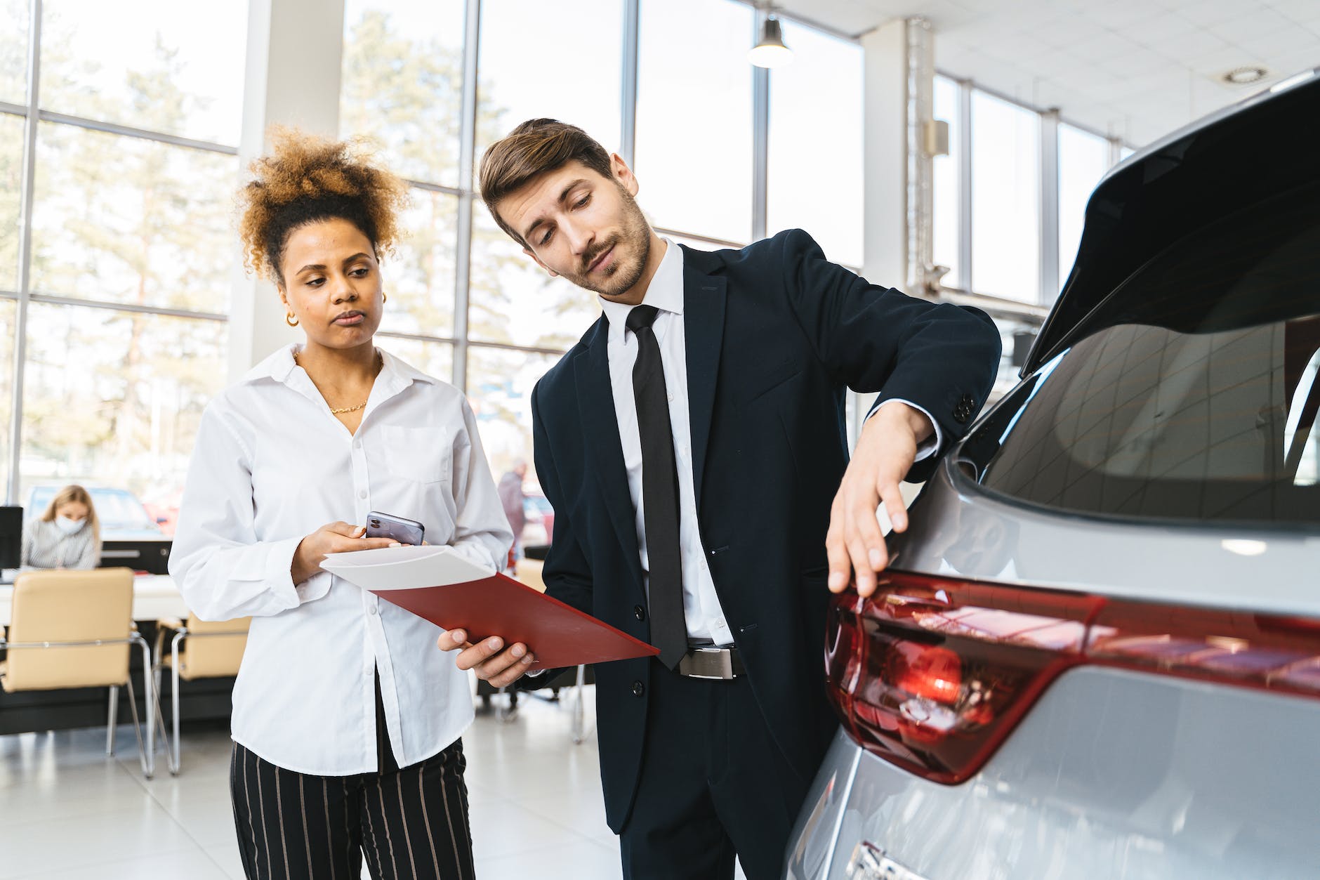 photo of a salesman talking to a customer