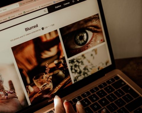 shot of laptop with stock images website opened